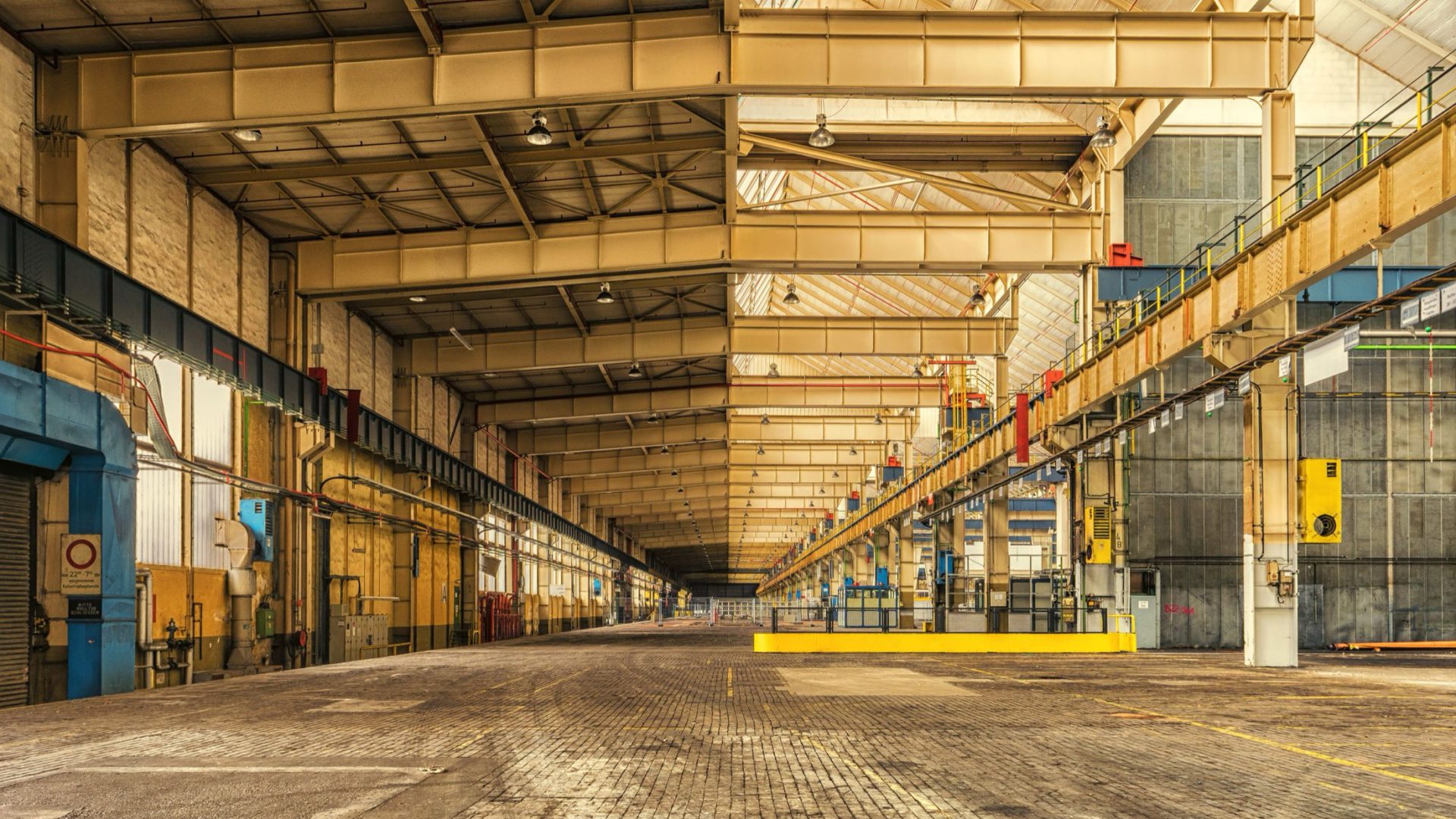 A business owner walking his own factory floor